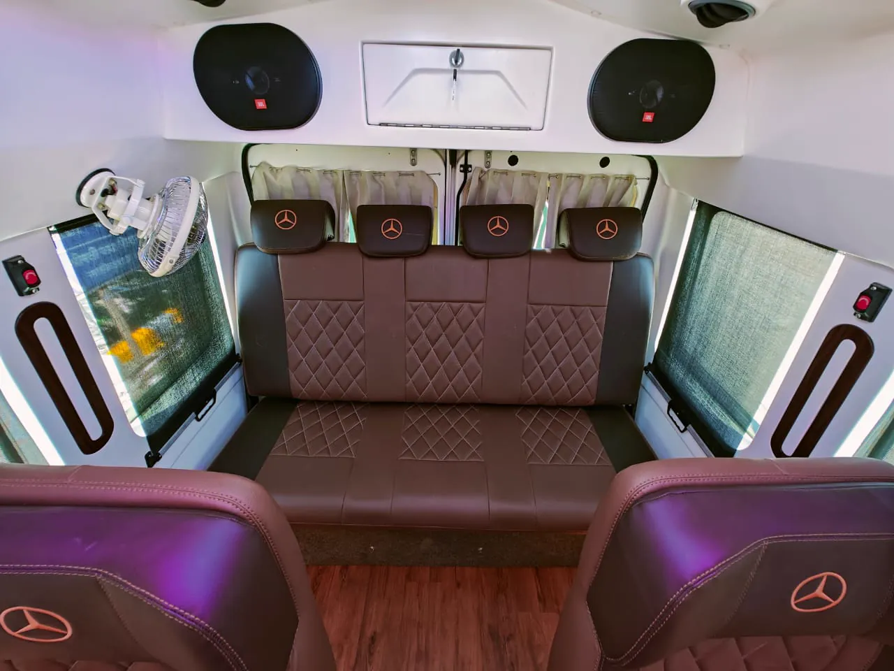 Maharaja tempo traveller, single recliners either side