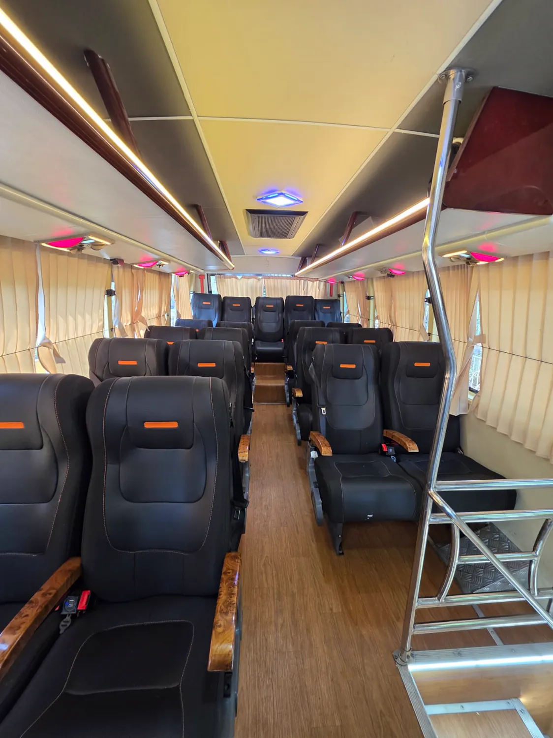 20 seater AC mini bus, large recliners down the aisle