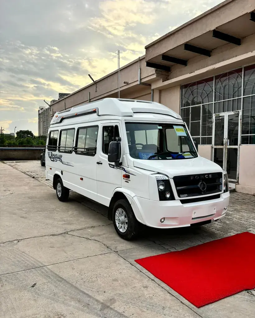 An Avante Travels tempo traveller parked outside the garage