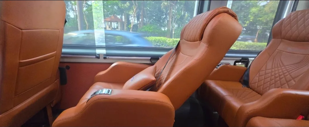 10 seater Maharaja Urbania, window seat in tan leather